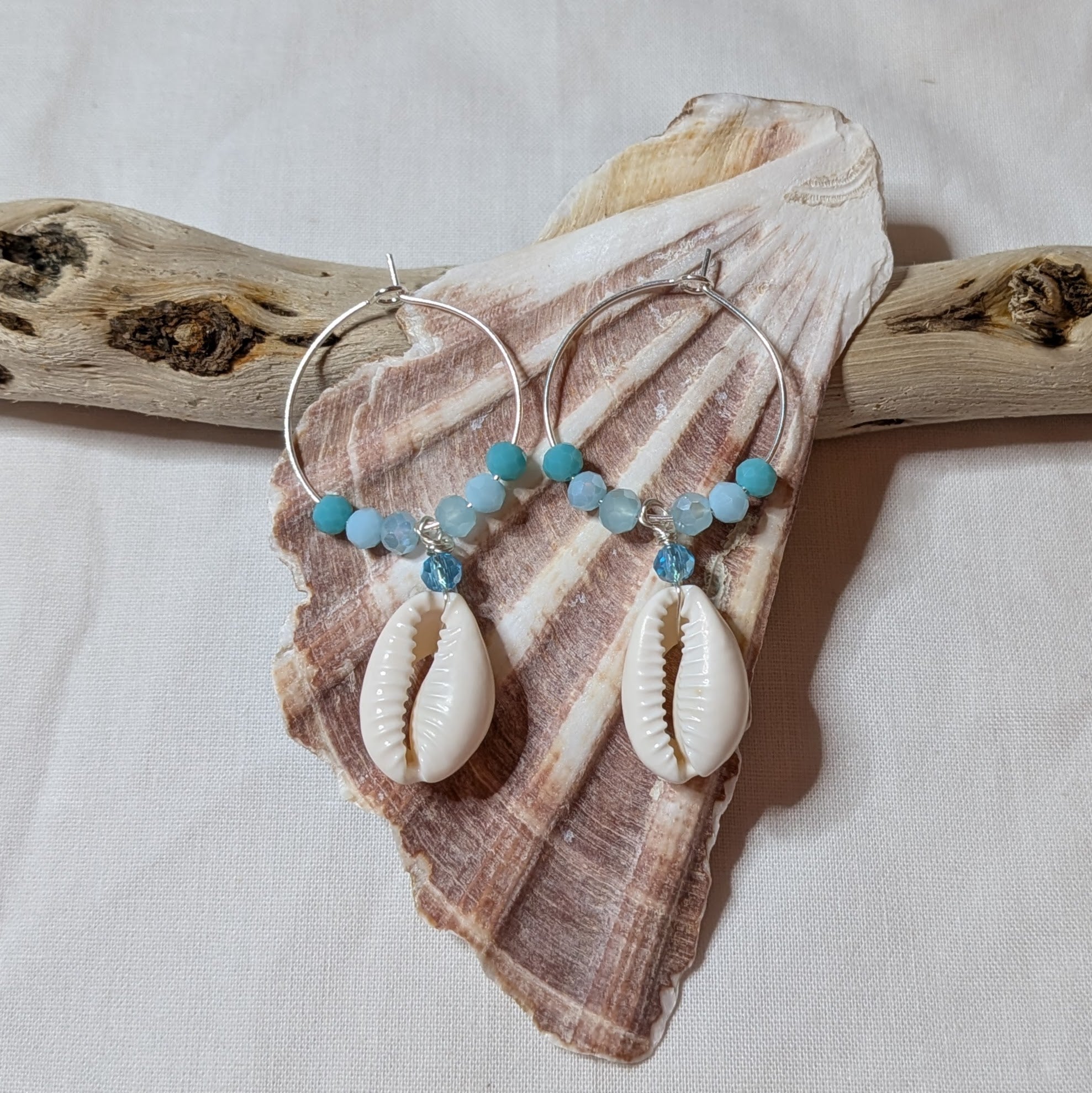 Large hoop cowrie shell earrings