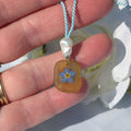 Yellow sea glass and forget me not necklace