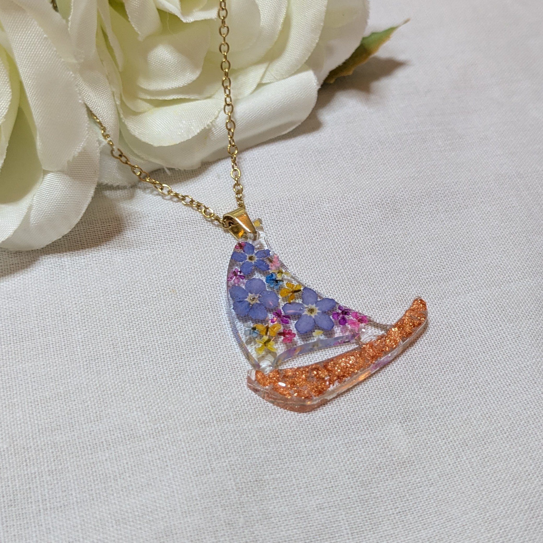 Floral sail boat necklace