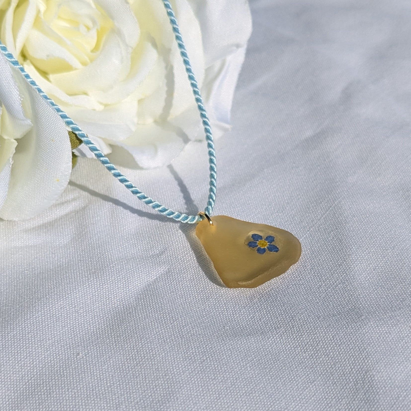 Pale yellow sea glass and forget me not necklace