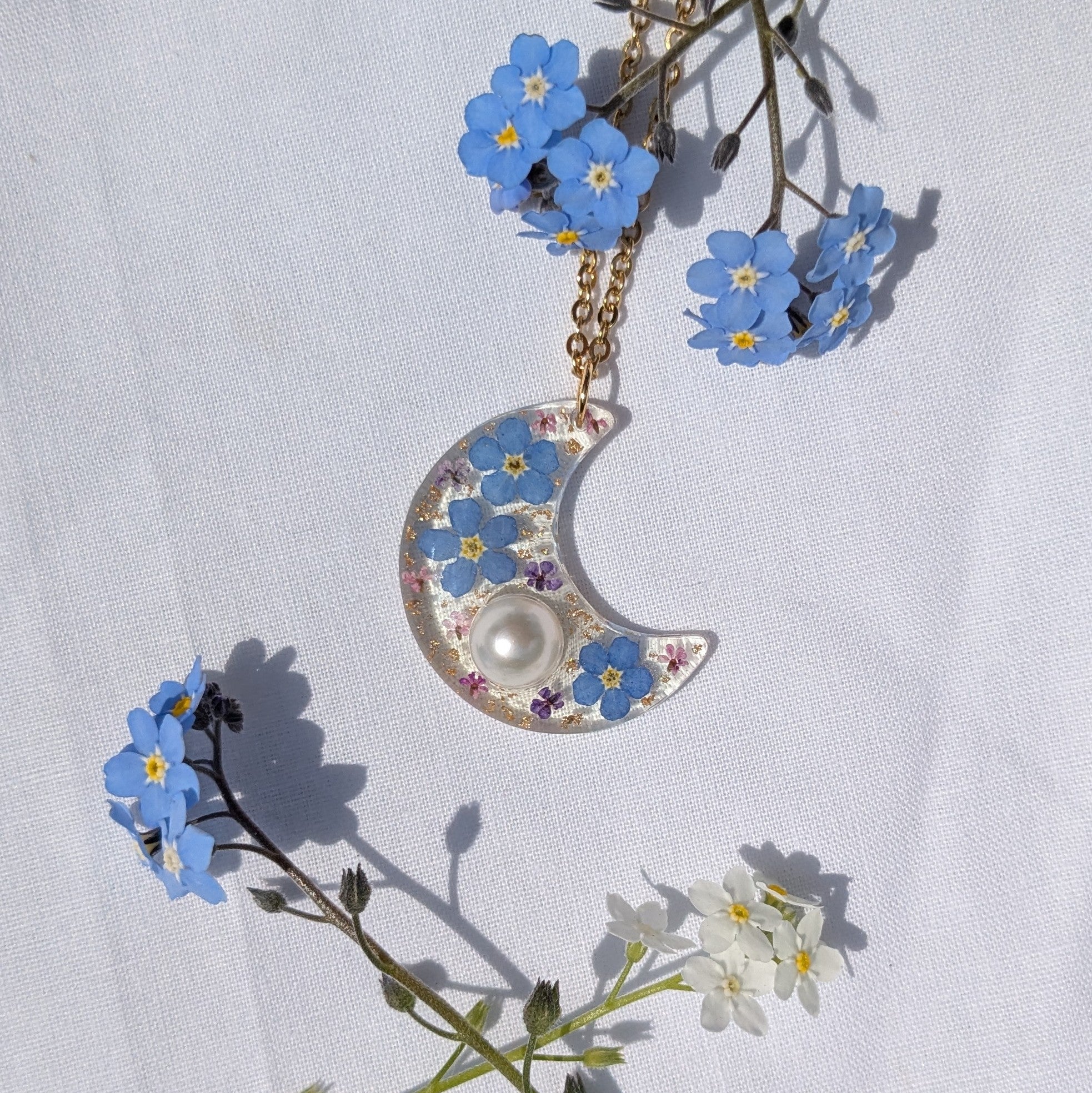 Pearl and forget me not moon necklace