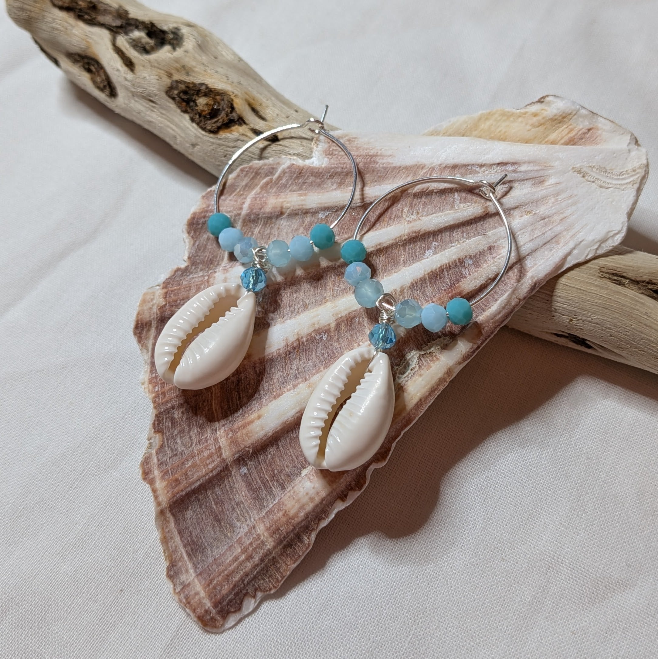 Large hoop cowrie shell earrings