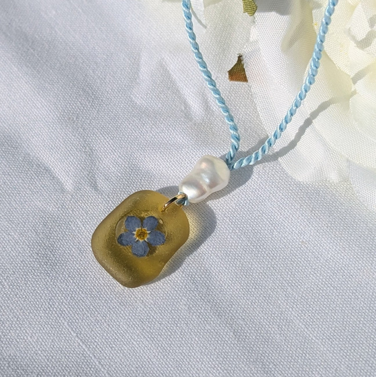 Yellow sea glass and forget me not necklace