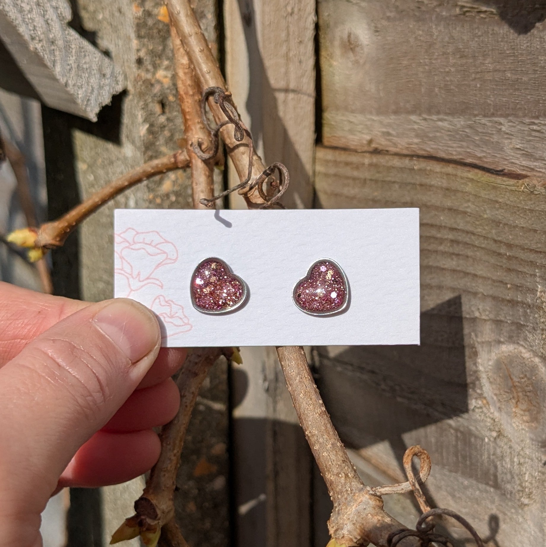 Pink glitter resin heart earrings