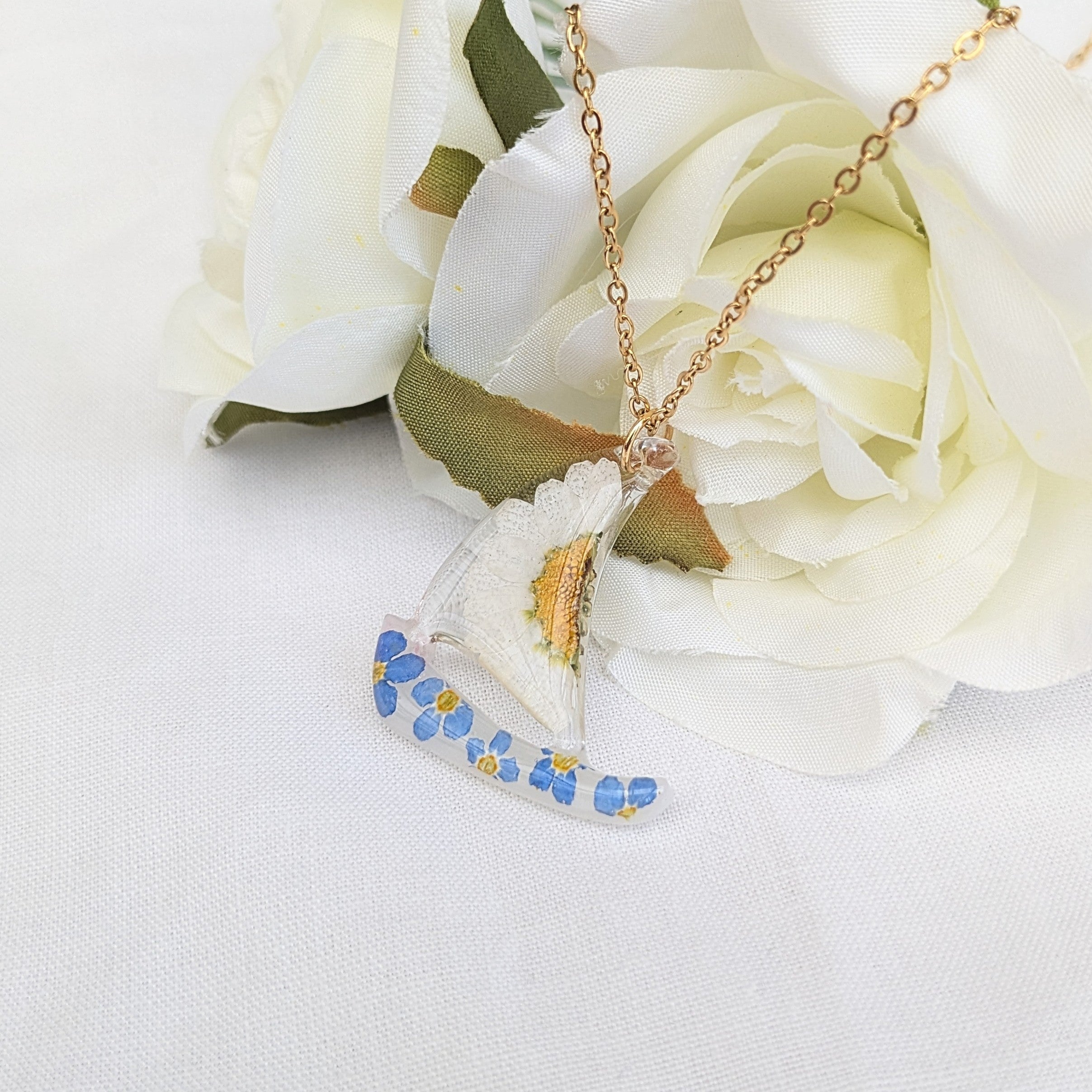 Floral sail boat necklace
