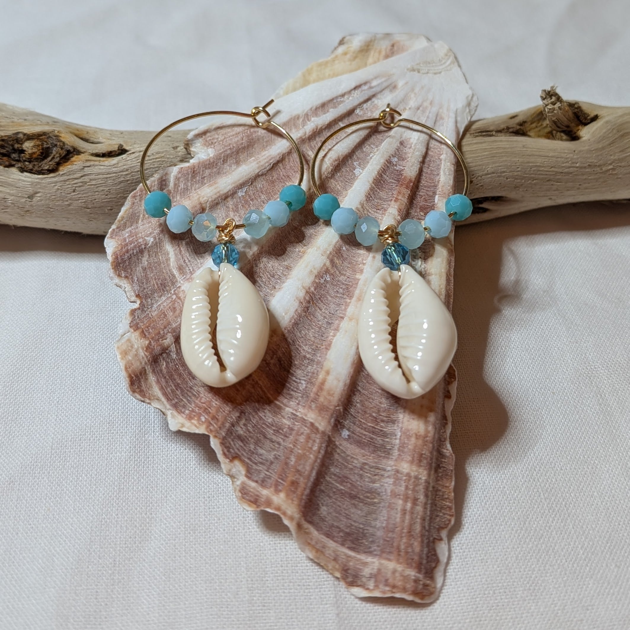 Large hoop cowrie shell earrings