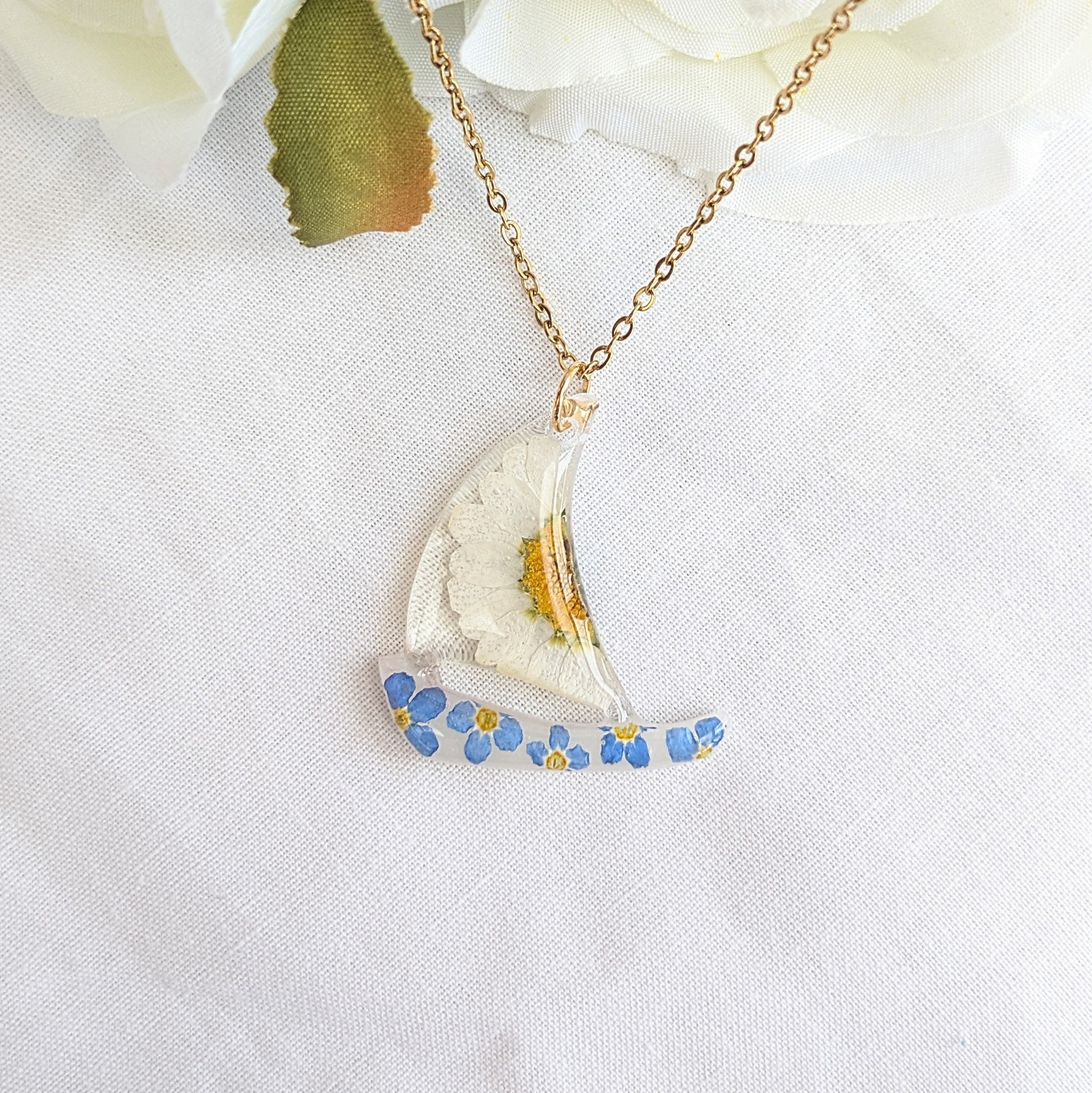 Floral sail boat necklace